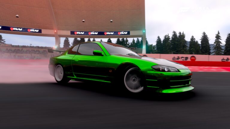 an image of a green nissan sylvia drifting through a corner, with a cloud of tyre smoke coming from the rear wheels.